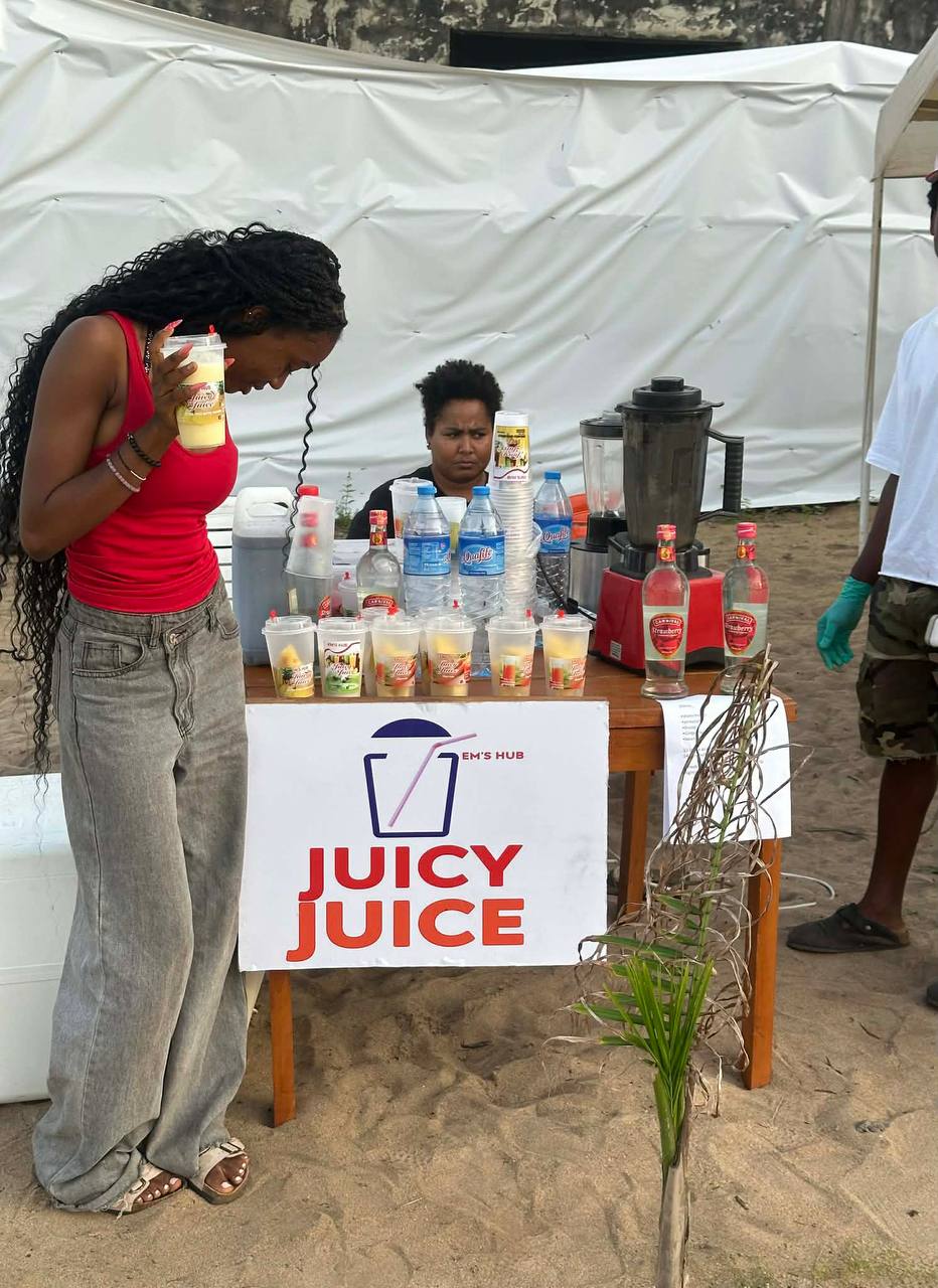 Juicy Juice pop-up stand serving customers